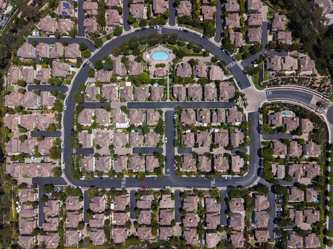 Overhead drone perspective of a master planned residential community with pools