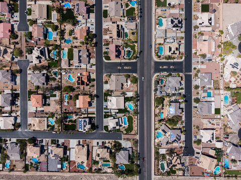 Top down drone shot of desert landscape residential cul-de-sacs and pools
