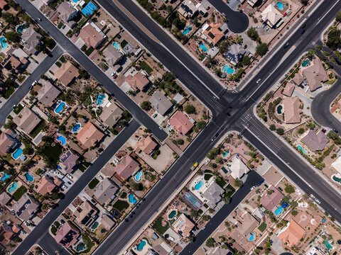 Top down drone shot of desert landscape residential cul-de-sacs and pools