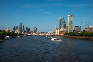 Fototapeta premium London, UK, 27th May 2026 - London Skyline from Waterloo bridge showing building work in progress and the main financial district, late evening suchine,mid shot