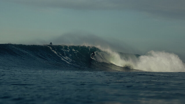 surfing large waves in moody seas