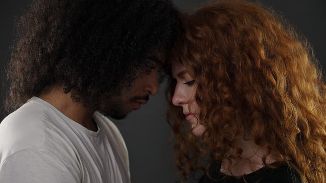 Couple with heads together showing intimacy, connection, and relationship