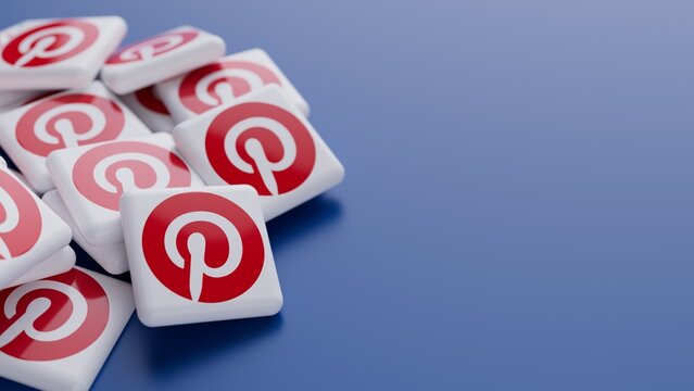 Berlin, Germany - May 28, 2026: Close-up of the Pinterest logo in a pile on blue background with copy space as web banner header