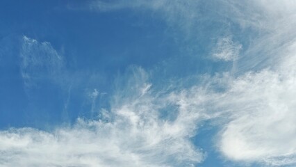 Dramatic white cloud formation against a deep blue sky creating a striking natural weather scene. Suitable for atmospheric backgrounds, environmental themes, travel visuals, and outdoor design project © fedro