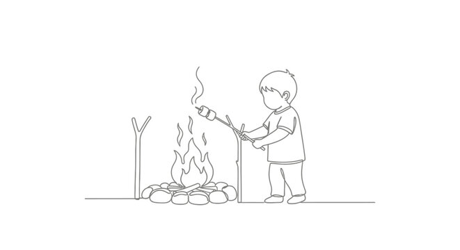 Young child carefully tending to small campfire outdoors.