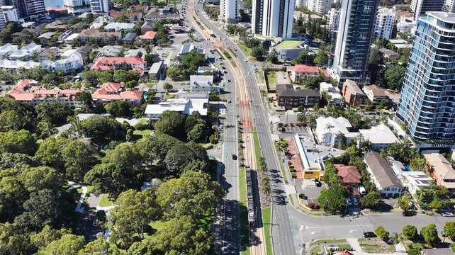 Aerial View of a Modern Light Rail Tram Moving Through Gold Coast