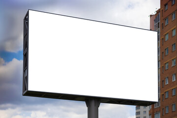 Fototapeta premium Advertising billboard along the road in the city. Background for design. 