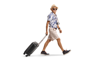 Naklejka premium Tourist with a suitcase walking