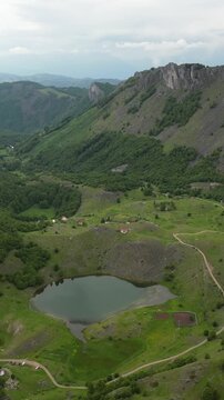 Beautiful aerial view showing lake bukumir, a glacial lake in the kuci area of montenegro, surrounded by green hills and mountains