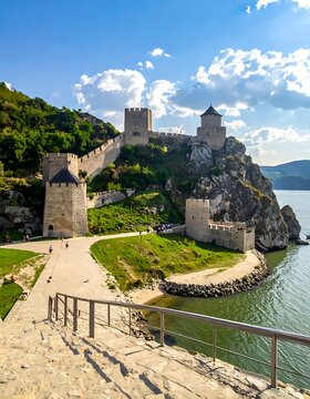 Medieval Castle on Rocky Cliffside by Sea.