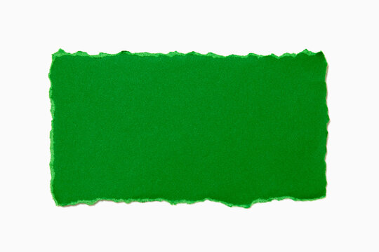 Green torn paper on white background