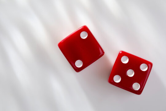 Two red dice on white background