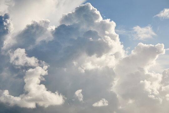 White puffy cumulous clouds and blue sky