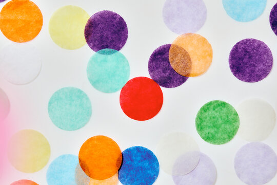 Close-up of colorful confetti on white background