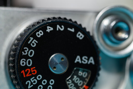 Close-up of vintage camera ASA and shutter speed numbers dial