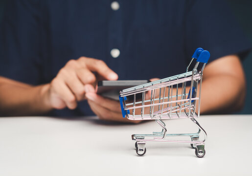 Businesswoman Shopping Online with Mini Cart