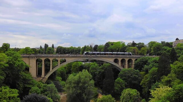 Train running ove the old stone bridge in Luxembourg city