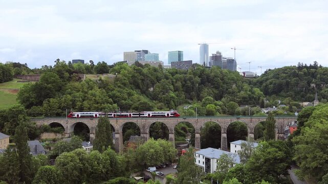 Train running ove the old stone bridge in Luxembourg city