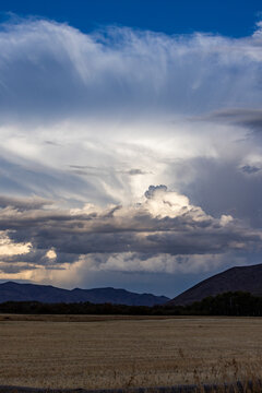 Storm clouds over field