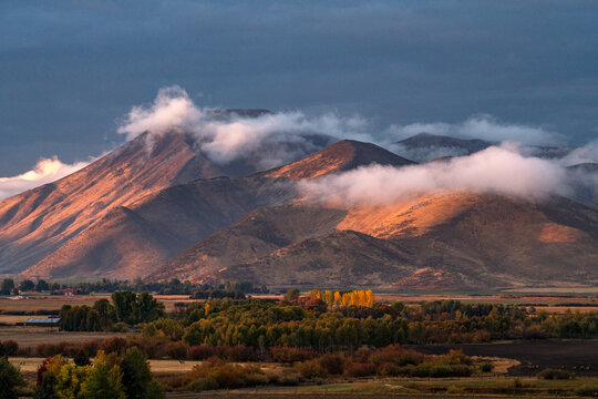 Clouds covering hills in late afternoon light