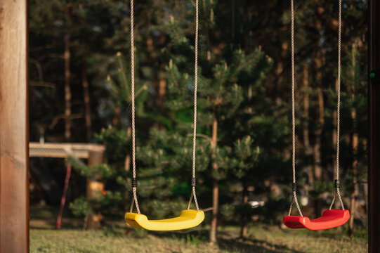 Children's playground, swings, and outdoor sports area