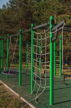 Children's playground, swings, and outdoor sports area