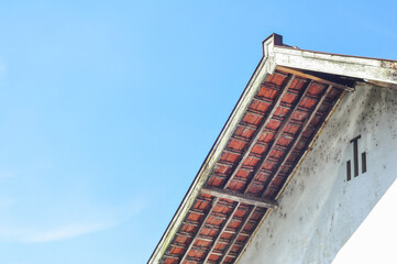 Fototapeta premium Traditional House Roof Under Blue Sky