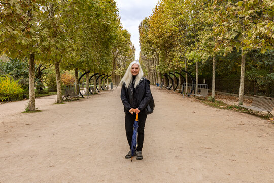 Portrait of smiling woman in Jardin des Plantes