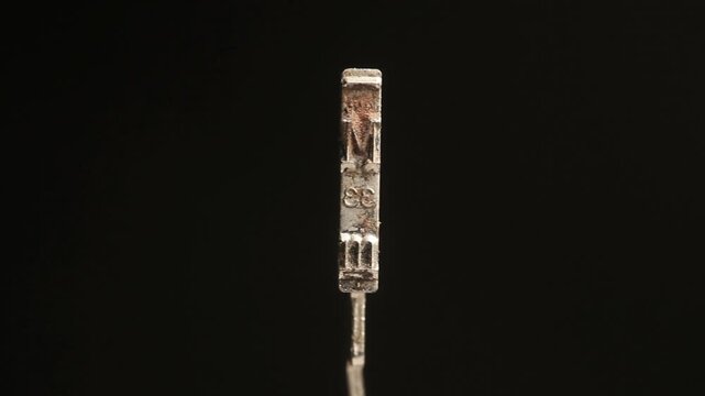 letter M with vintage typewriter hammer isolated on black 