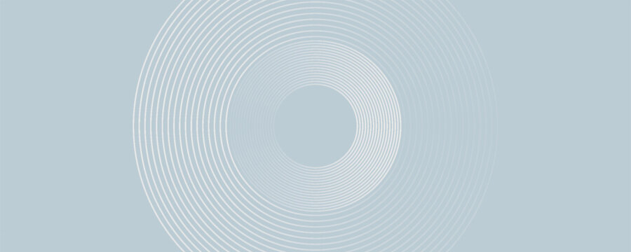 Abstract image composed of multiple layered circles on a light grey background.