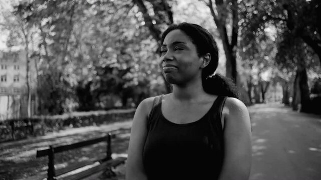 African American woman expressing stress and concern in monochrome with focused and uneasy expression creating dramatic and introspective