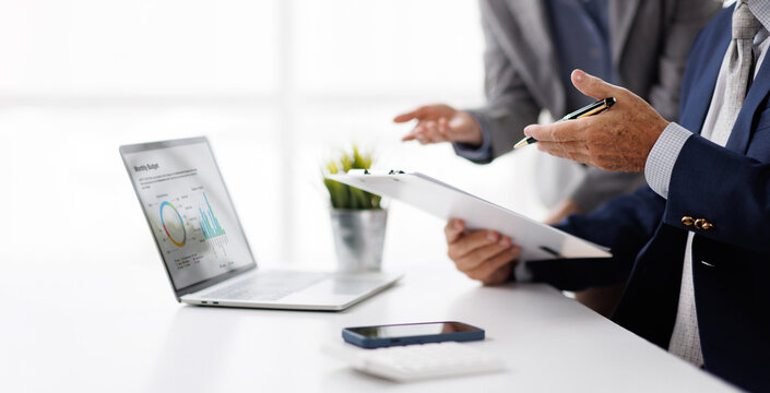 Hands and graphs on tablet screen for finance results, profit growth and budget review. Staff, team and digital with financial report, revenue stats and dividend comparison of risk assessment