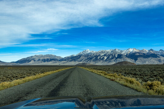 Empty rural road over Trail Creek Pass seen from vehicle