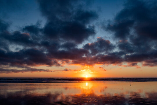 Sun setting over calm ocean