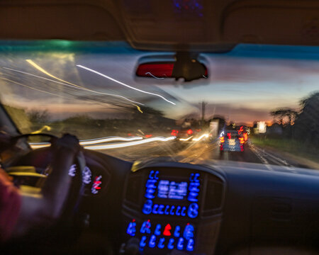 Passenger view of dusk traffic from car, blurred motion