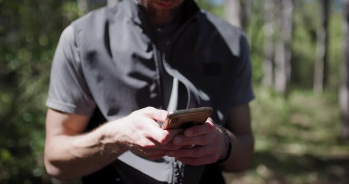 Exploring the features of a multifunctional outdoor vest ideal for hiking in lush forests during sunny afternoons