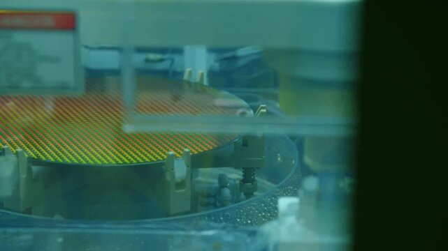 Semiconductor Manufacturing Facility Silicon Wafer Chemical Vapor Deposition Layer Processing in 4K Ultra HD footage.
