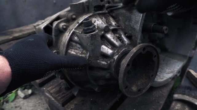 manual transmission from an old car removed for cleaning and washing, repair and replacement of oil seals