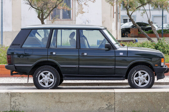 Dark green range rover classic parked outdoors