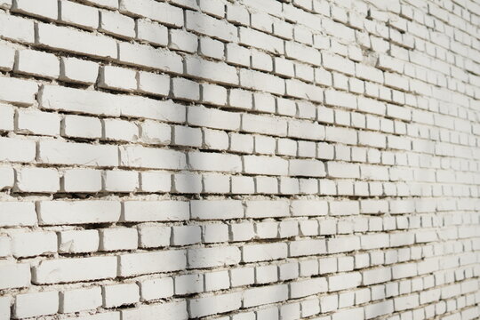 White brick wall texture with regular pattern for background use