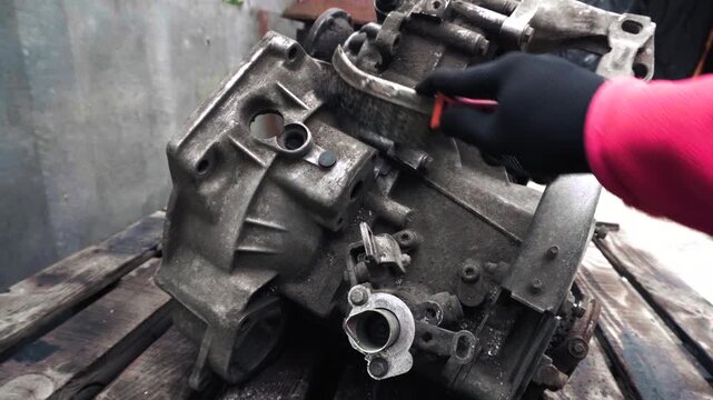 manual transmission from an old car removed for cleaning and washing, repair and replacement of oil seals