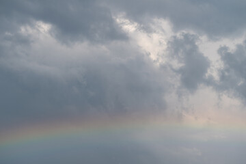 Obraz premium Rainbow signals renewal. Rainbows bring calm and hope. Soft rainbow arcs evoke resilience after rainfall. Gentle rainbow curves under clouds suggest renewal and optimistic futures