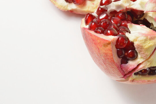 pomegranate on a white background and copy space