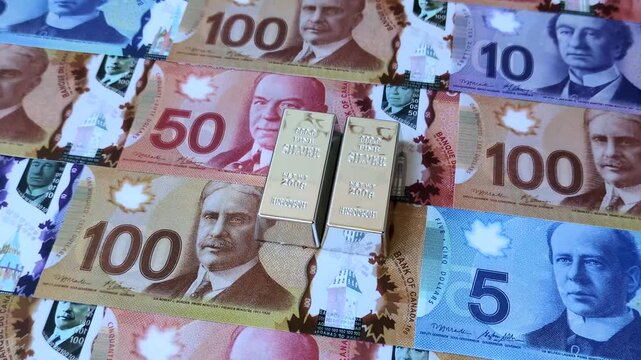 A silver bar, white metal against a backdrop of Canadian money, as a concept for the sales market. A silver bar as a background for your design