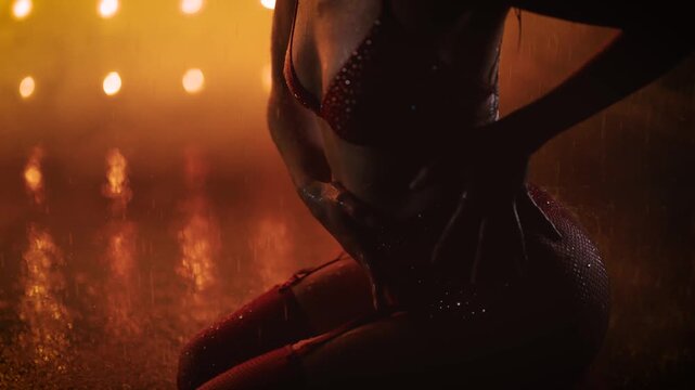 Close Up of Woman Body on Wet Floor Under Golden Lighting