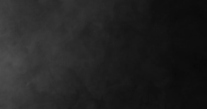 Detailed slow motion rising smoke isolated on black background. Cinematic fog overlay with soft swirling motion, ideal for VFX compositing, transitions and atmosphere.