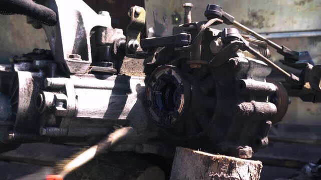 manual transmission from an old car removed for cleaning and washing, repair and replacement of oil seals