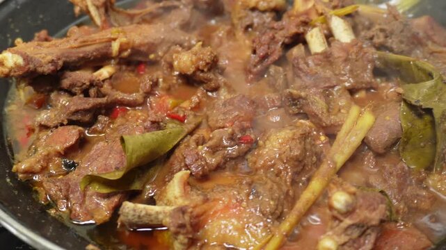 Closeup footage of rendang on the pan