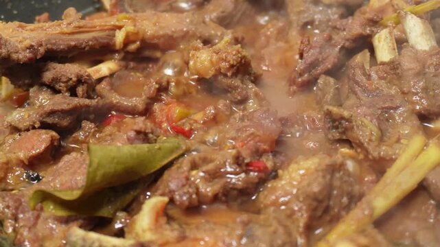 Closeup footage of rendang on the pan
