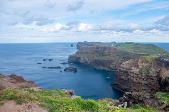 Viewpoint Calhau da Furna do Bode on Madeira, green hills meet sea, discovery archipelago landscape, volcanic island travel, adventure vacation, colorful rooftops, Madeira, Portugal